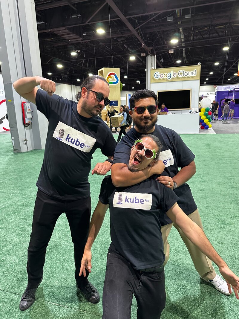Three hosts at a previous Kubernetes event